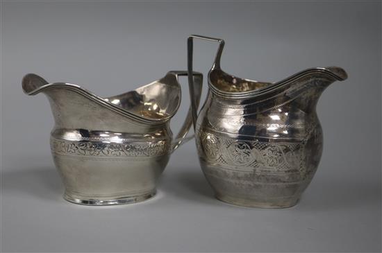 Two George III silver helmet shaped cream jugs, London, 1803 & 1806.